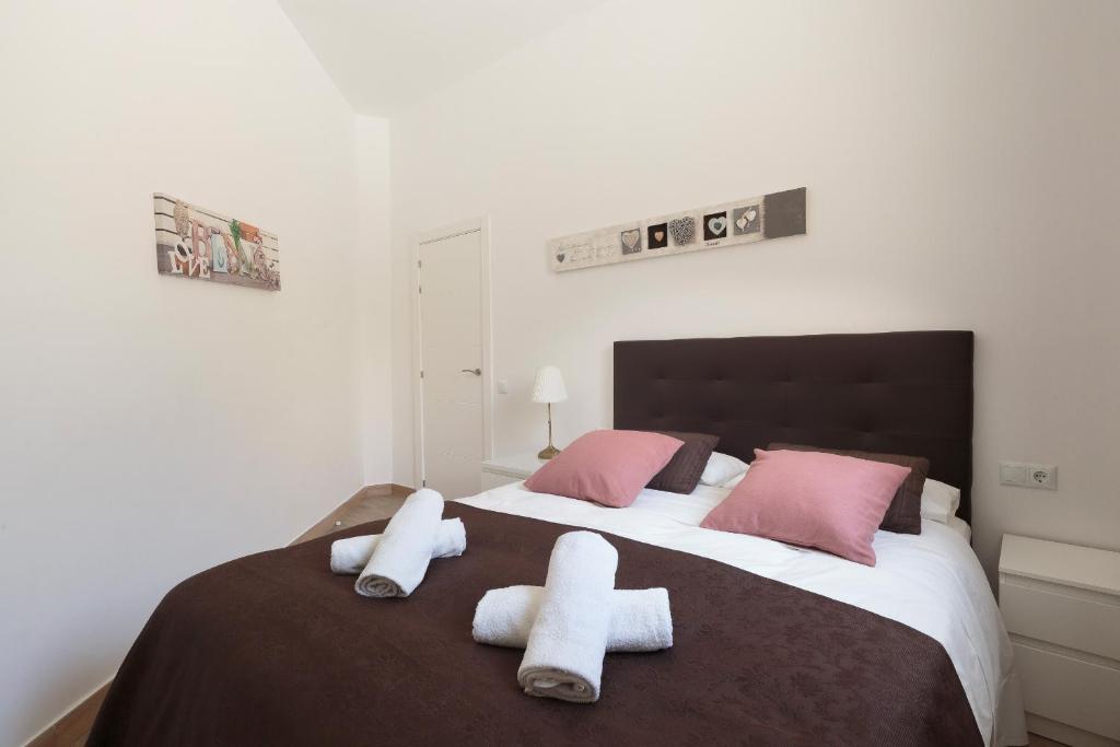 Posteľ alebo postele v izbe v ubytovaní Sagrada Familia Apartment