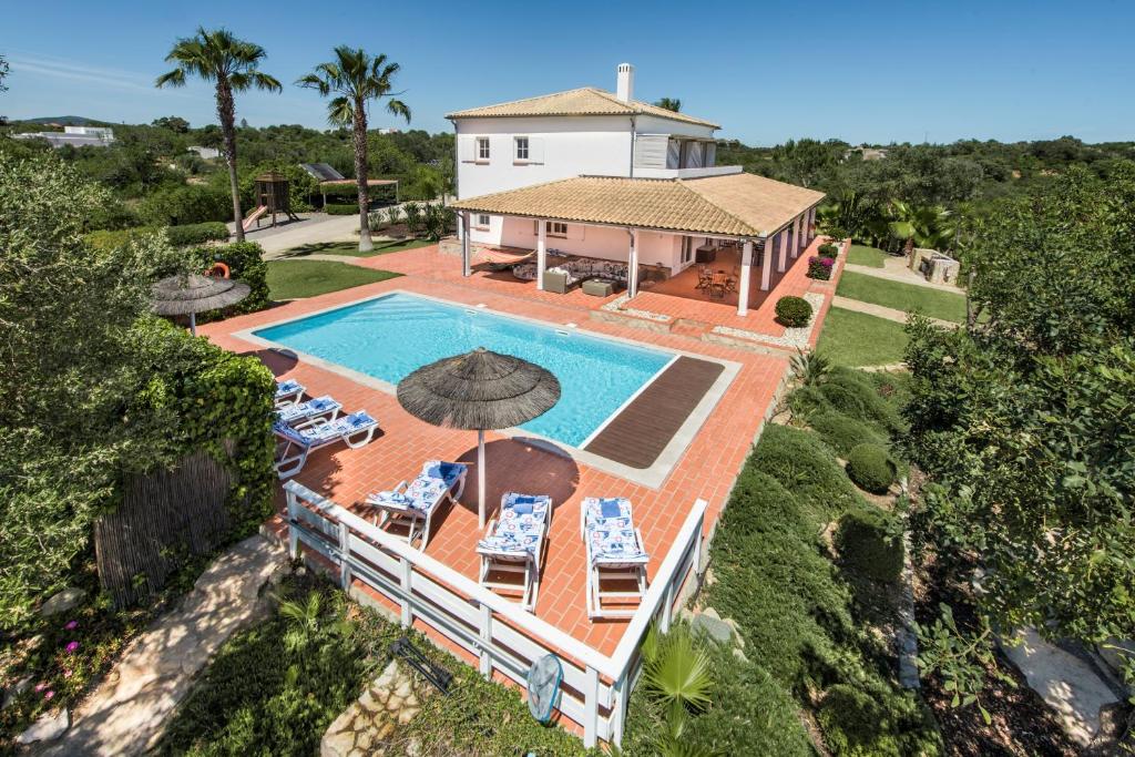an aerial view of a house with a swimming pool at VILLA MONTE PARDAL w/ Heated Pool in Natural Park in Moncarapacho
