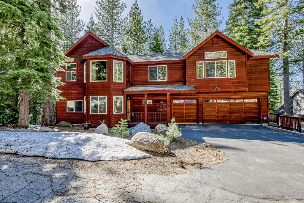 a large wooden house with a garage at Tahoe Discovery in South Lake Tahoe