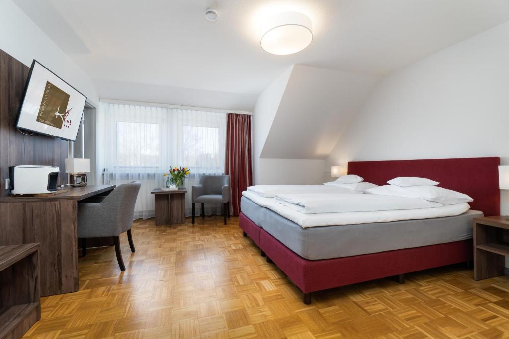 Postel nebo postele na pokoji v ubytování Hotel Grosse Klus