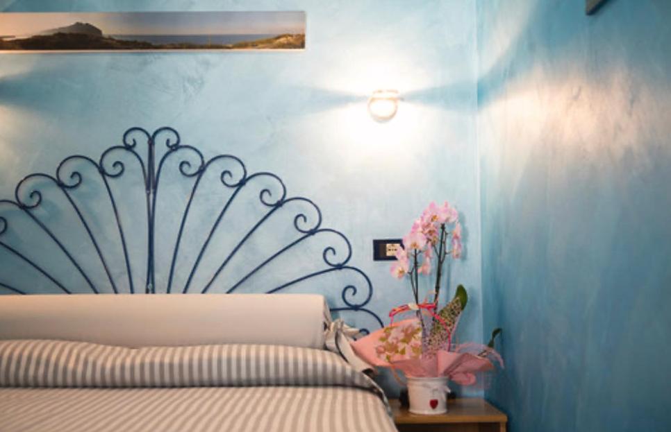 Postel nebo postele na pokoji v ubytování Hotel Il Gioiello