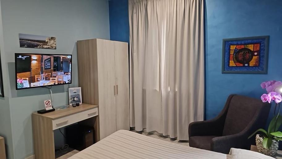 TV a/nebo společenská místnost v ubytování Hotel Il Gioiello
