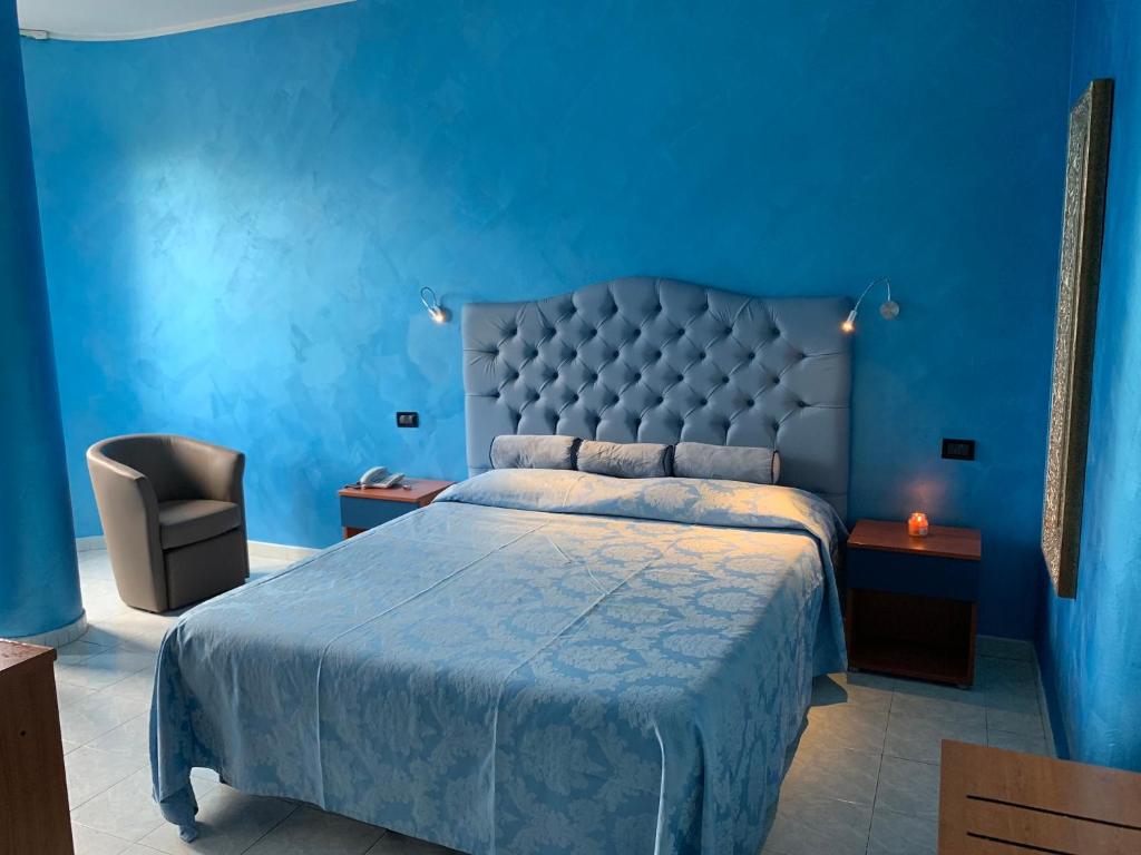 Postel nebo postele na pokoji v ubytování Hotel Il Gioiello