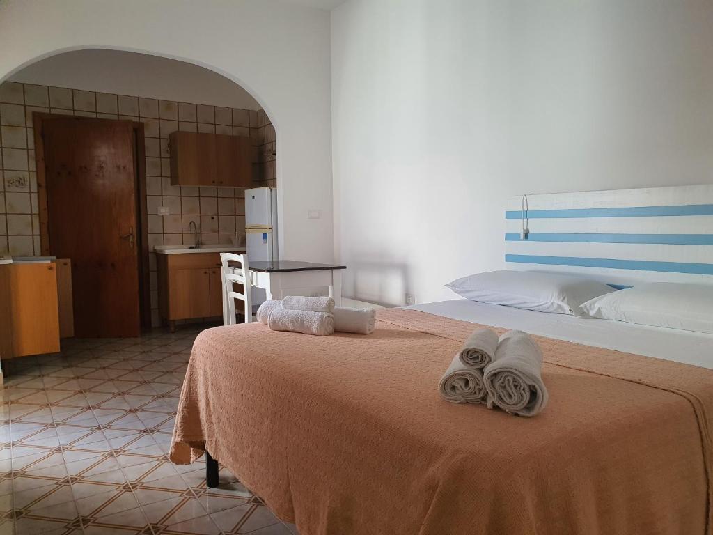 Postel nebo postele na pokoji v ubytování Lu Salentu Chalet Beach