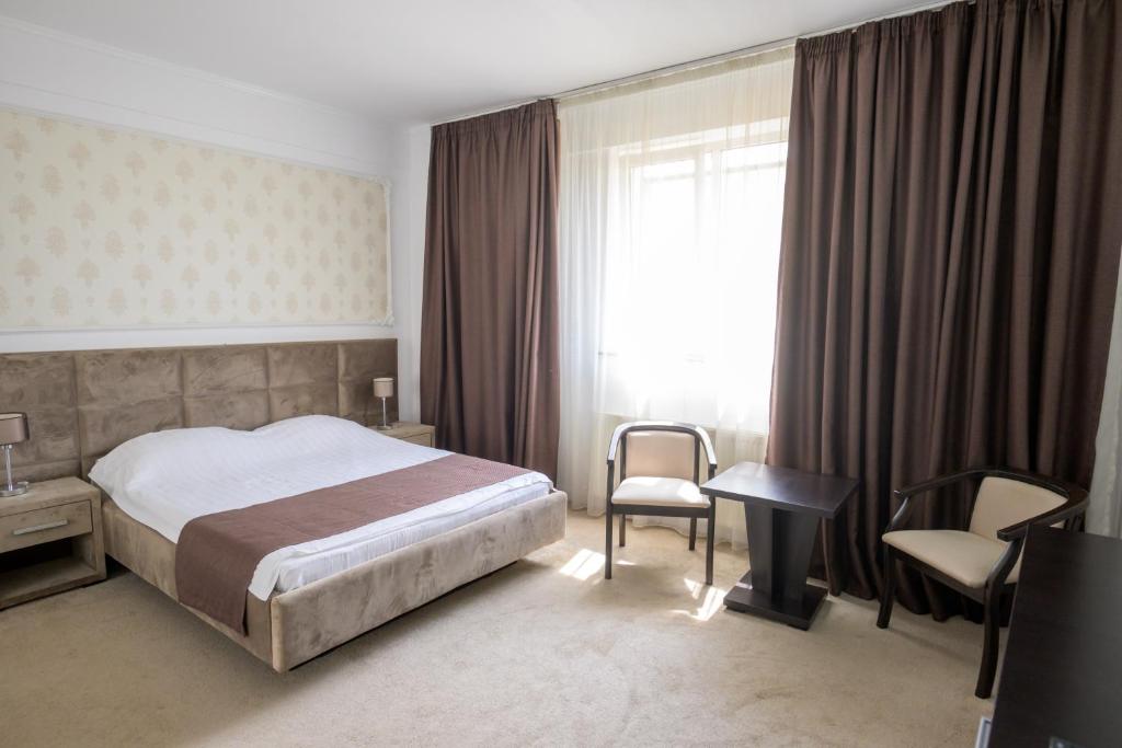 Postel nebo postele na pokoji v ubytování Hotel Maryiotis