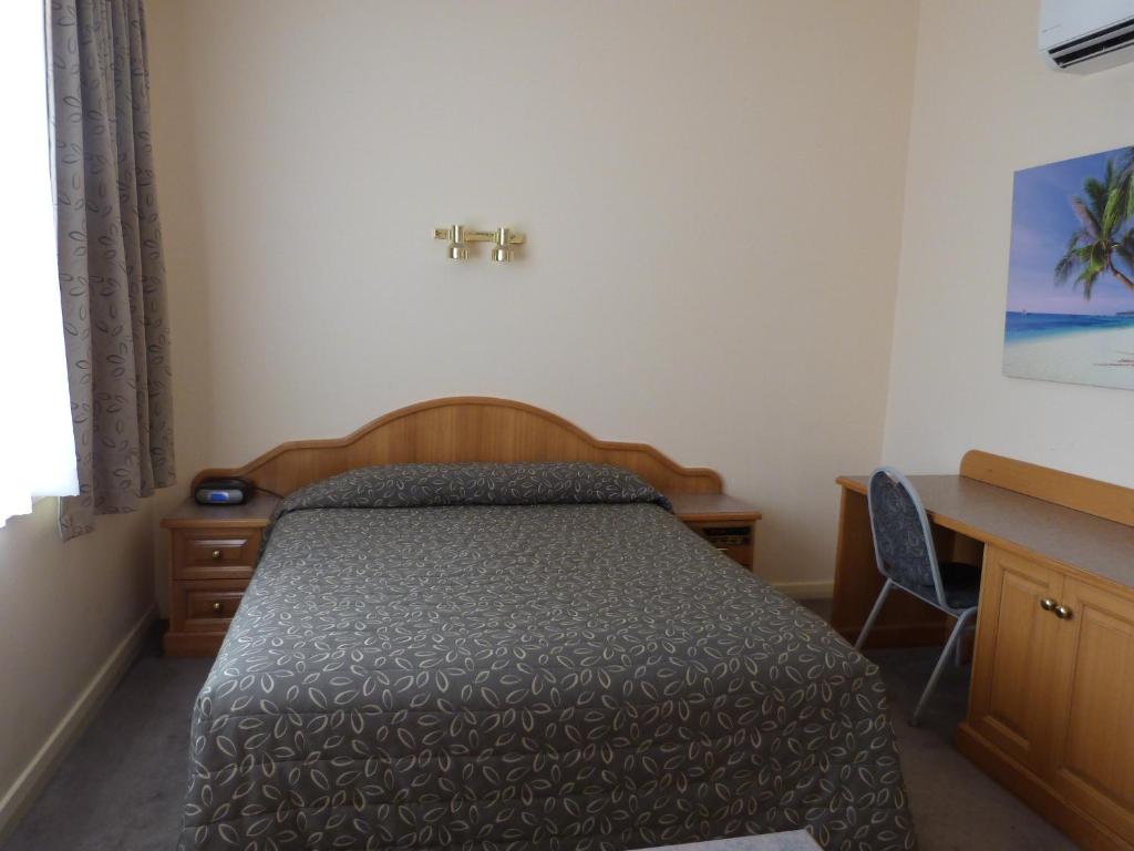 Postel nebo postele na pokoji v ubytování Glenelg Motel