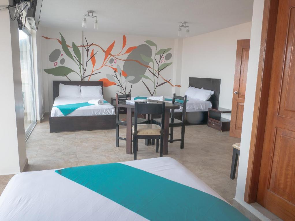 Postel nebo postele na pokoji v ubytování Margaritas Palace Hotel