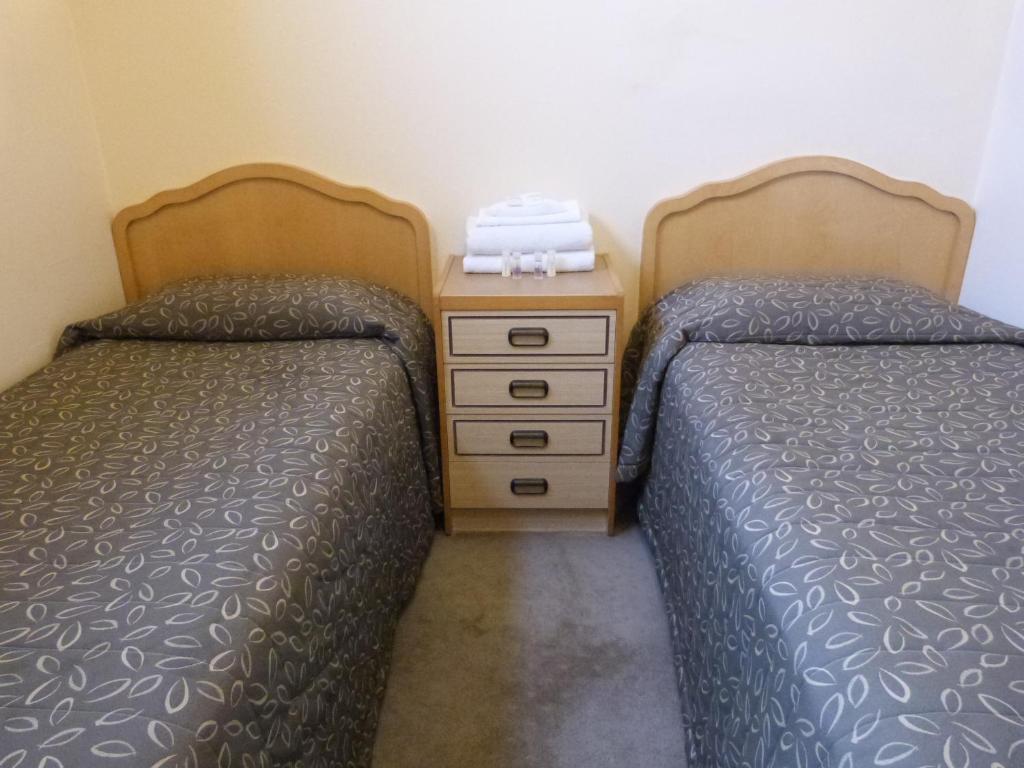Postel nebo postele na pokoji v ubytování Glenelg Motel