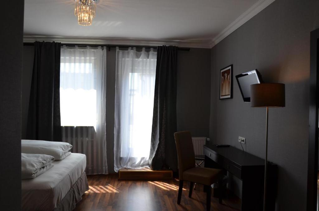 Postel nebo postele na pokoji v ubytování Hotel Rheinstein