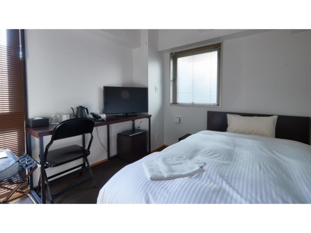 Un pat sau paturi într-o cameră la 8HOTEL CHIGASAKI - Vacation STAY 87545v