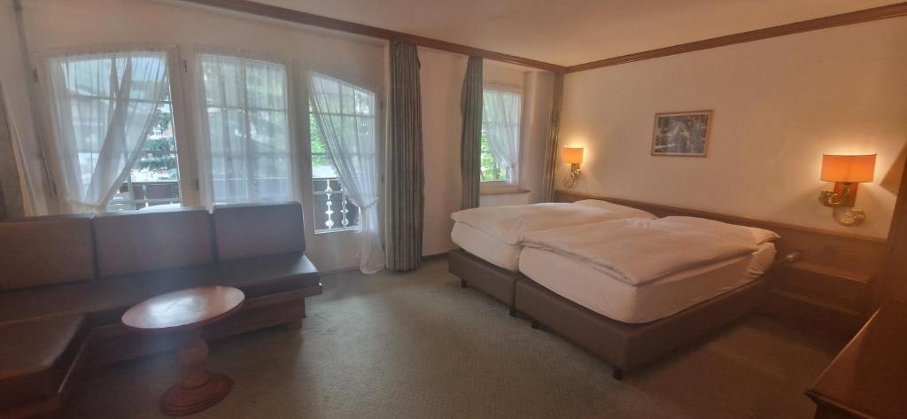 Postel nebo postele na pokoji v ubytování La Perle Apartments
