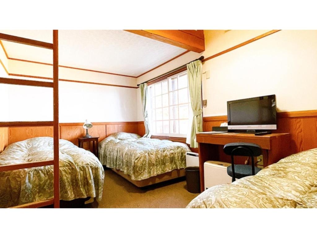 מיטה או מיטות בחדר ב-Hakuba Pension Meteor - Vacation STAY 63331v