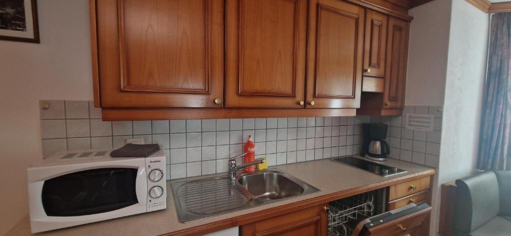 Kuchyň nebo kuchyňský kout v ubytování La Perle Apartments