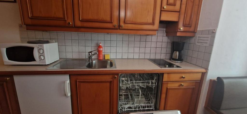 Kuchyň nebo kuchyňský kout v ubytování La Perle Apartments