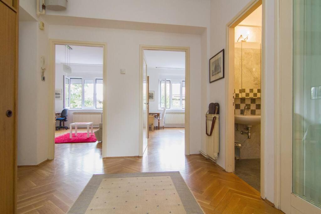 a living room with a hallway with a table and a sink at Apt. 80 m2, wifi, jacuzzi, 5 guests, 10min center in Zagreb