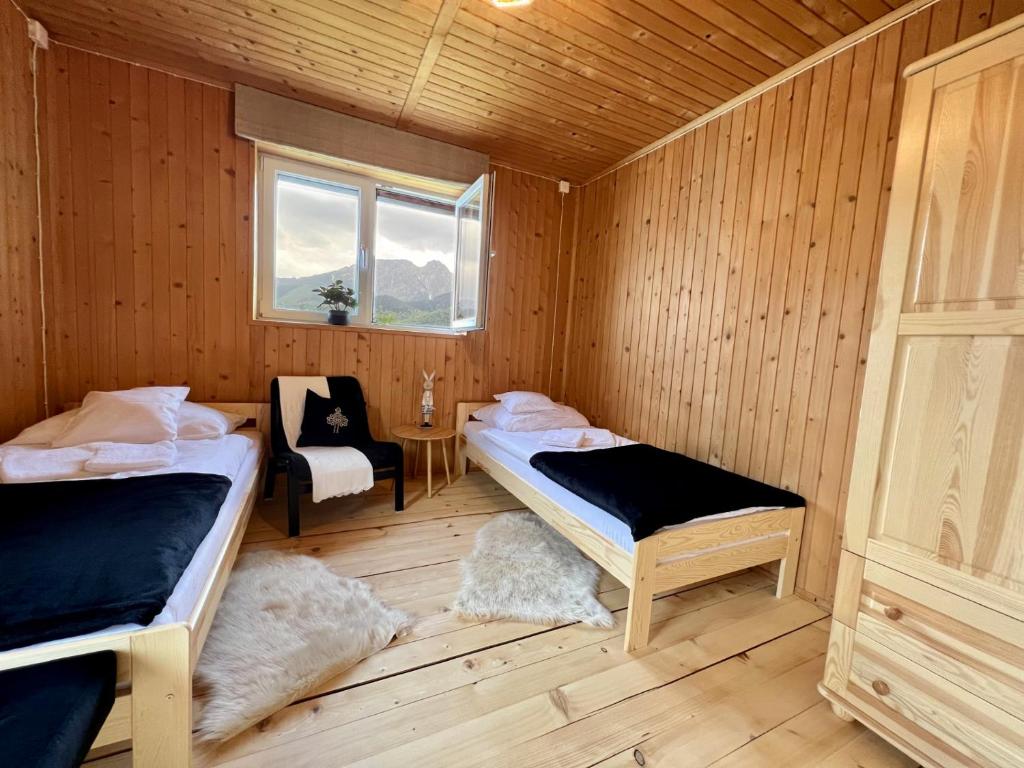 Posteľ alebo postele v izbe v ubytovaní Bystry Domek