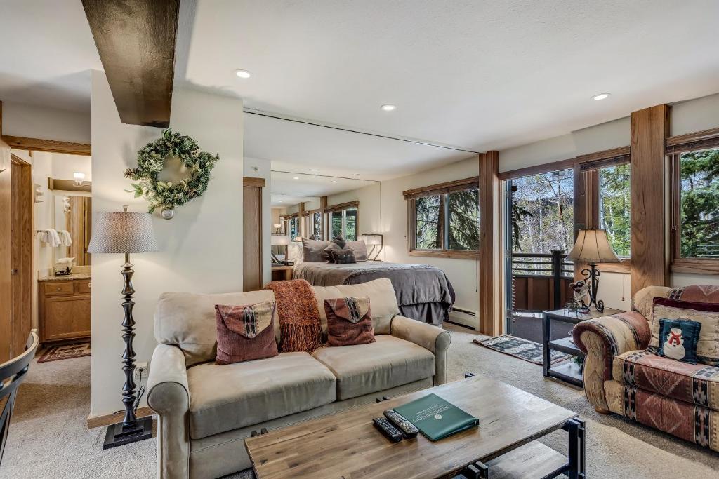 a living room with a couch and a bed at Laurelwood Condominiums 109 in Snowmass Village