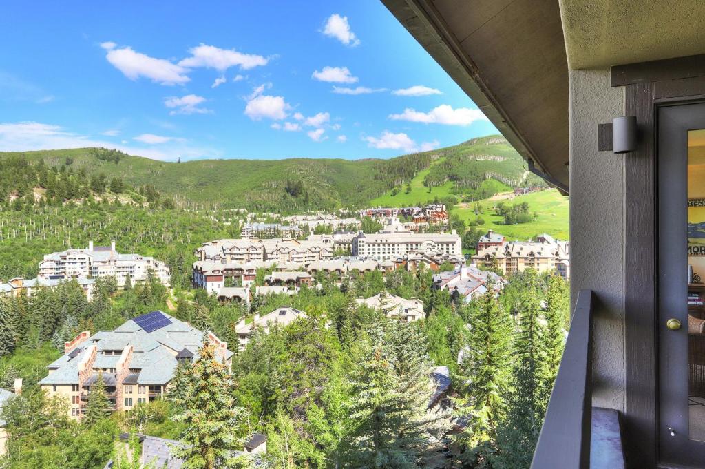 a view from the balcony of a resort in the mountains at The Pines Lodge, a RockResort, by Vail Resorts in Beaver Creek