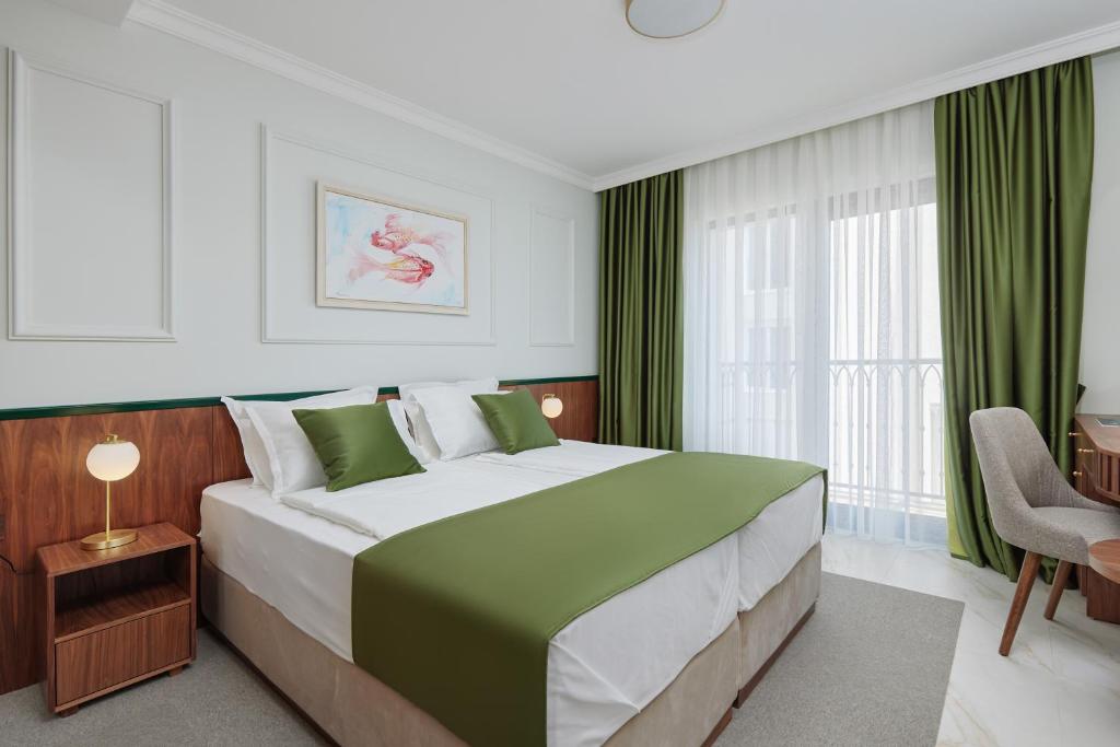 Postel nebo postele na pokoji v ubytování Hotel Diplomat by Aycon
