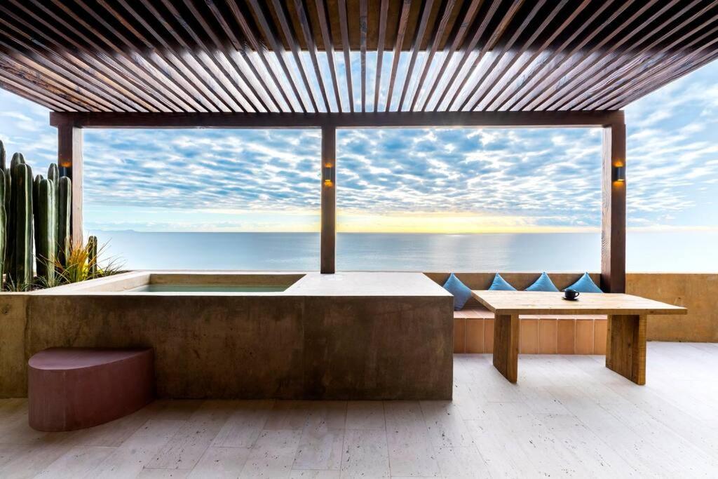 a room with a tub with a view of the ocean at 6 Guests - Amazing Views -Top Design in San José del Cabo