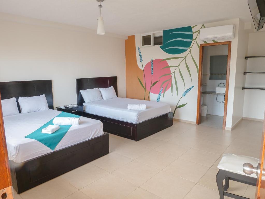 Postel nebo postele na pokoji v ubytování Margaritas Palace Hotel