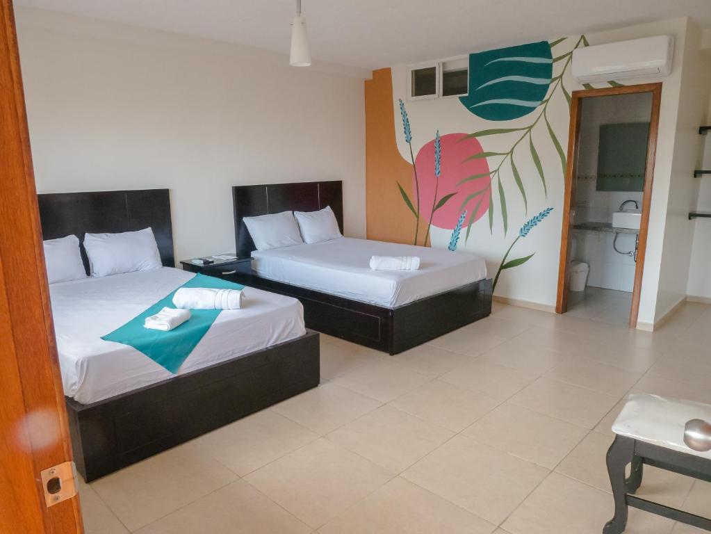 Postel nebo postele na pokoji v ubytování Margaritas Palace Hotel