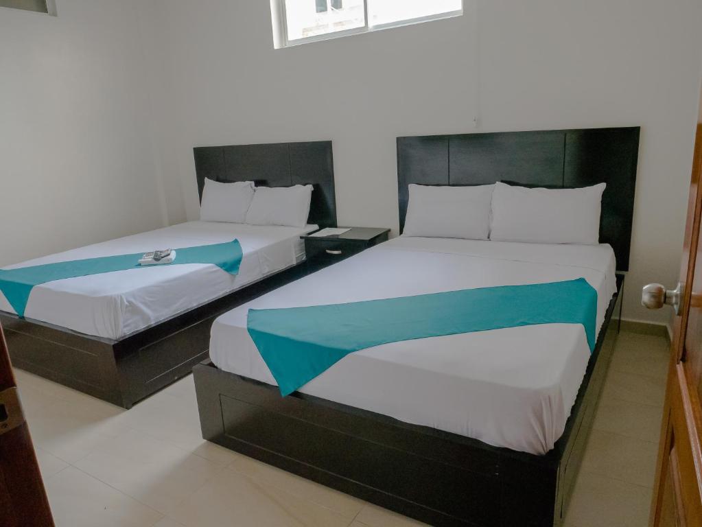 Postel nebo postele na pokoji v ubytování Margaritas Palace Hotel