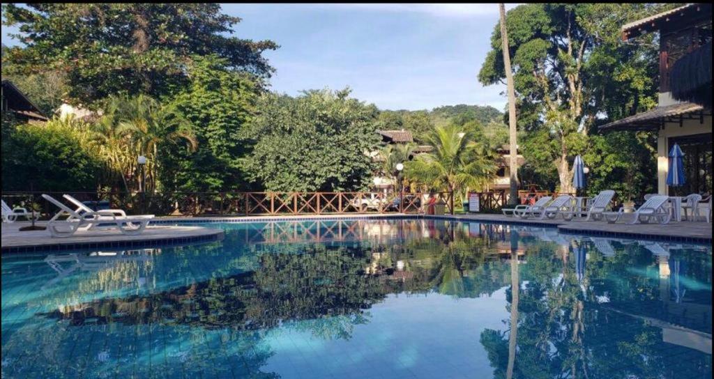 Kolam renang di atau dekat dengan Casa L2 em condomínio fechado frente a praia Maresias