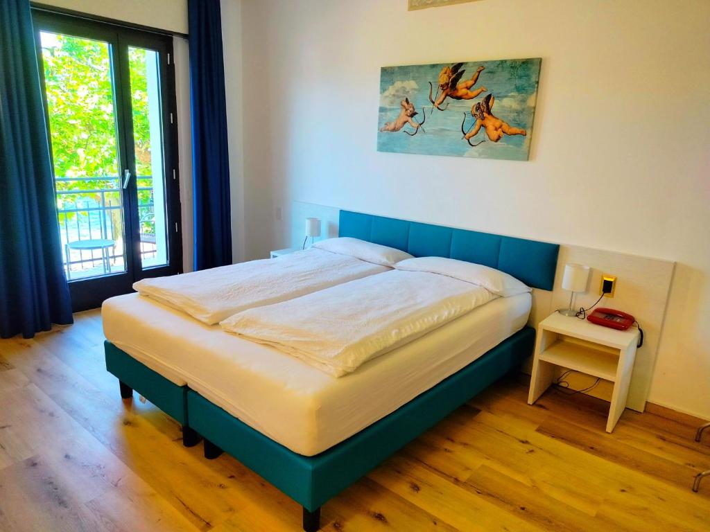Posteľ alebo postele v izbe v ubytovaní Hotel S.Maria