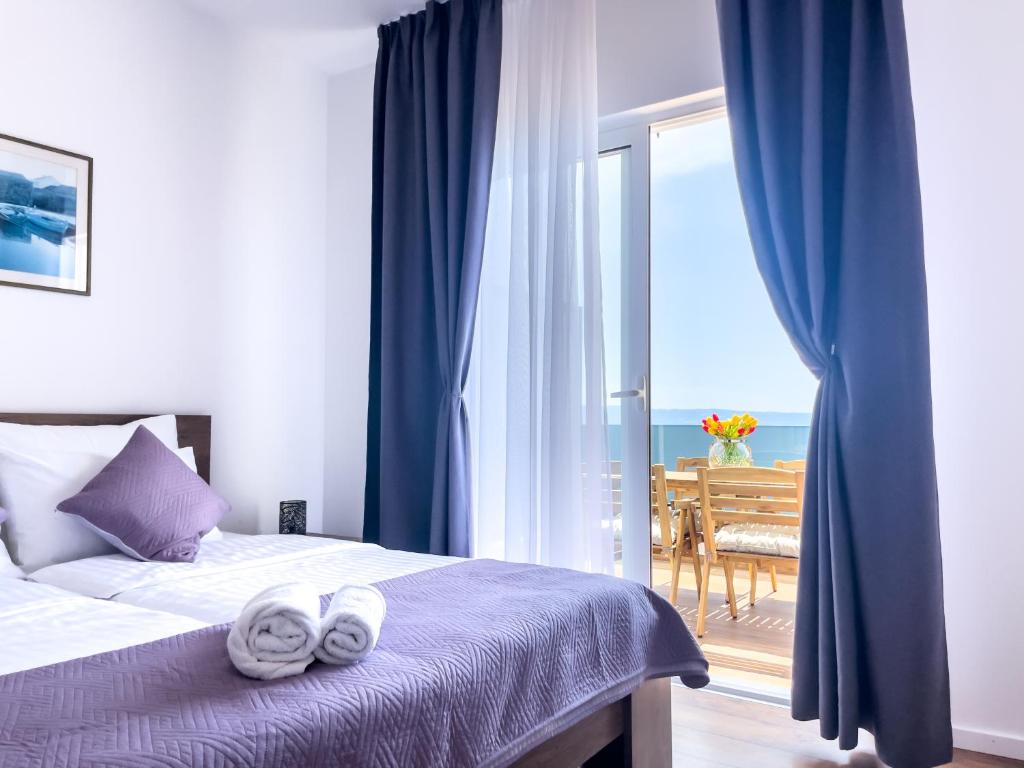 Postel nebo postele na pokoji v ubytování Apartments Goro