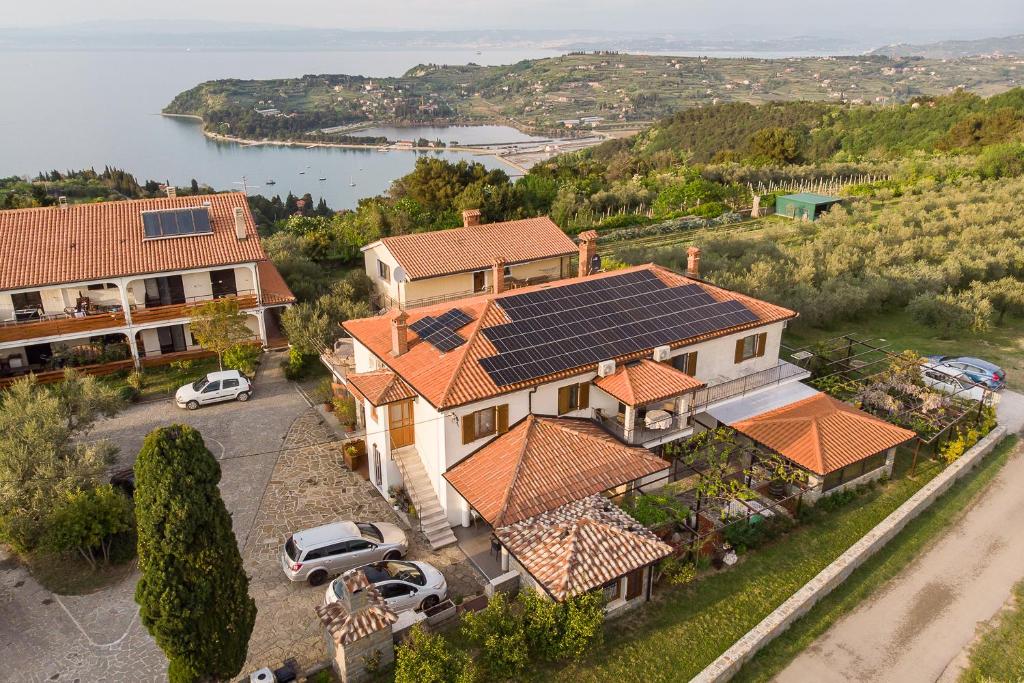 an aerial view of a house with solar panels on its roof at Olive Hill Apartment in Portorož