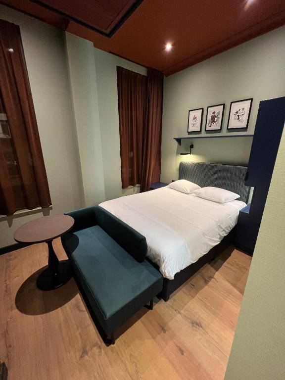 Postel nebo postele na pokoji v ubytování Hotel Nicolaas Witsen