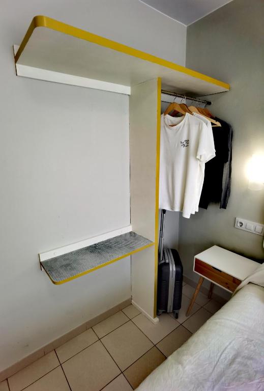 Postel nebo postele na pokoji v ubytování HOSTAL RIGAU