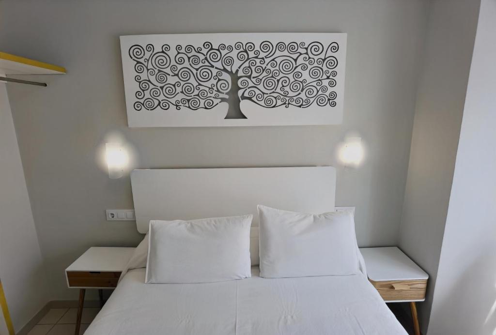 Postel nebo postele na pokoji v ubytování HOSTAL RIGAU