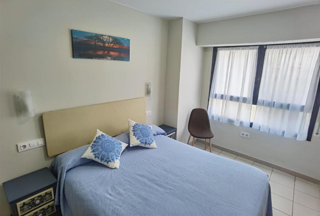 Postel nebo postele na pokoji v ubytování HOSTAL RIGAU