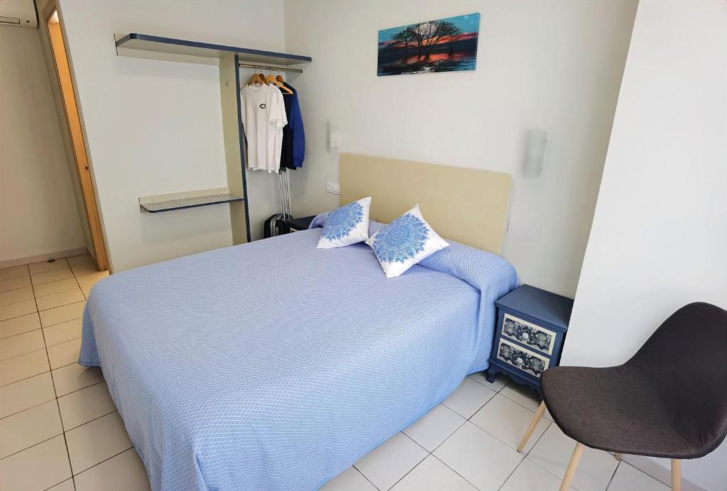 Postel nebo postele na pokoji v ubytování HOSTAL RIGAU