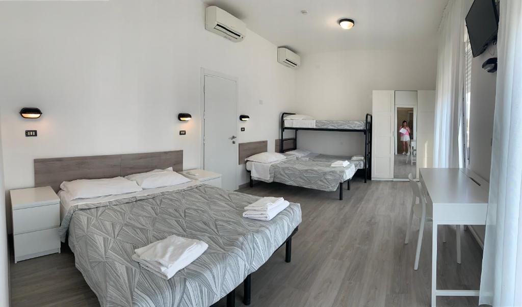Postel nebo postele na pokoji v ubytování Hotel Laika