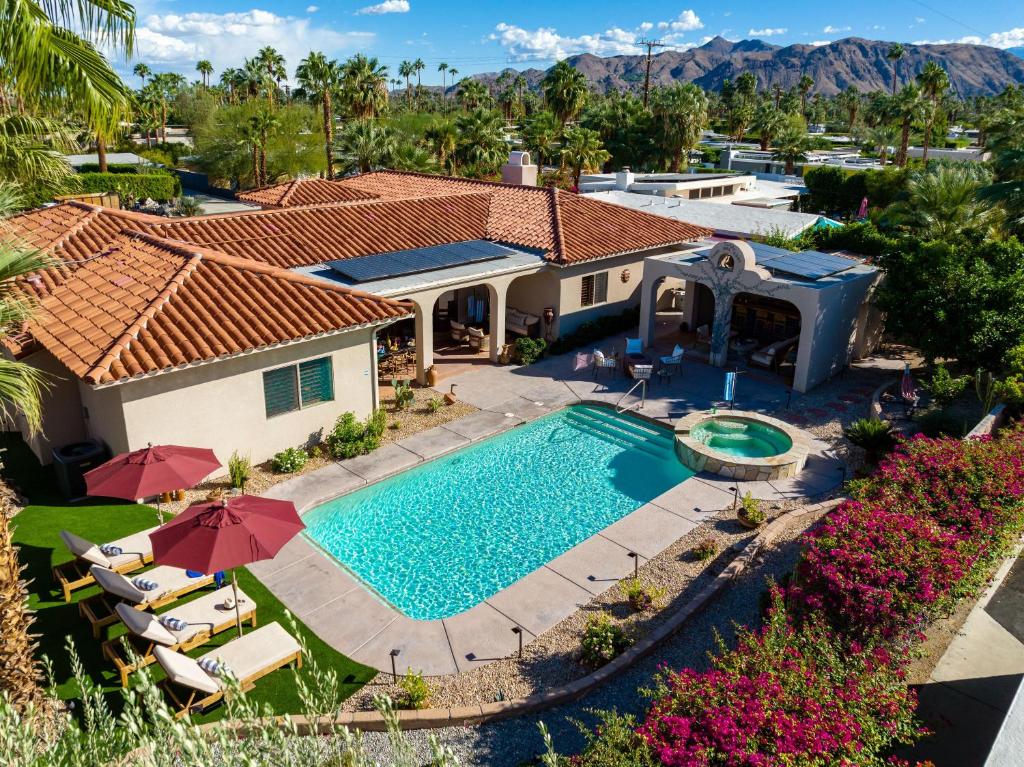 an aerial view of a house with a swimming pool at Casa Del Lobo in Palm Springs