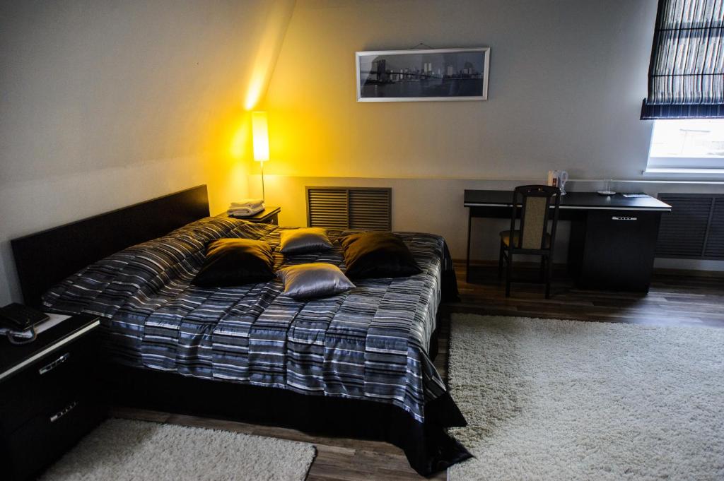 Кровать или кровати в номере Отель Бушуевъ