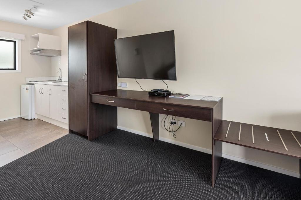 Kuchyň nebo kuchyňský kout v ubytování ASURE Rotorua International Motor Inn