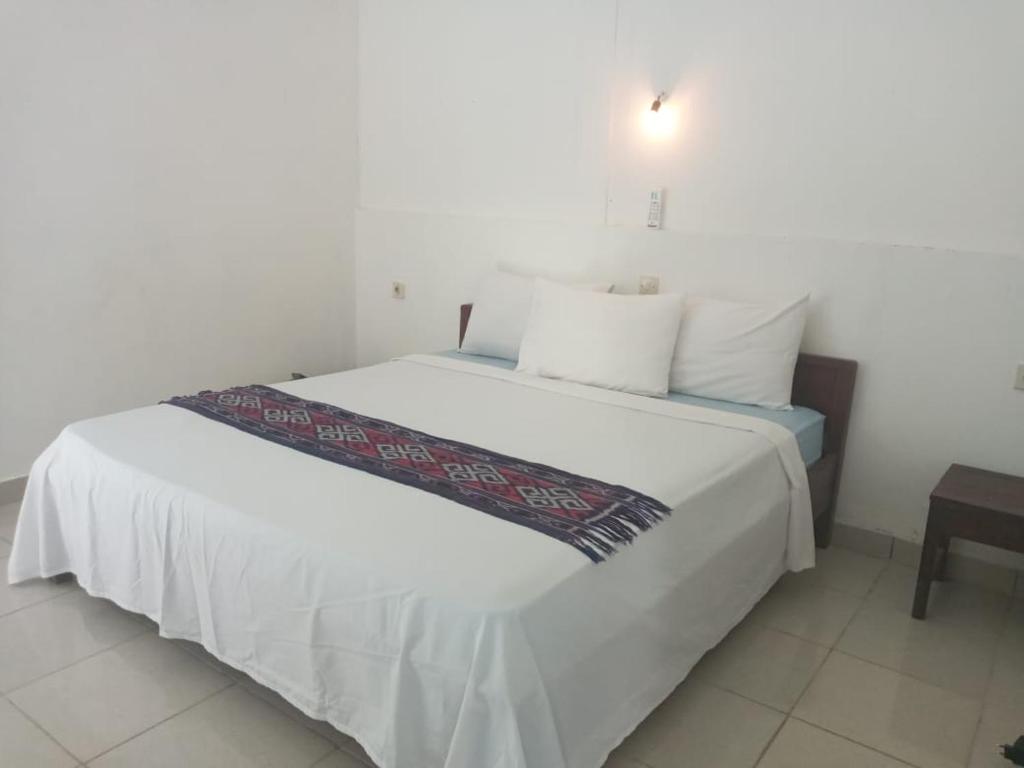 Postel nebo postele na pokoji v ubytování Bukit Garden Gili Trawangan