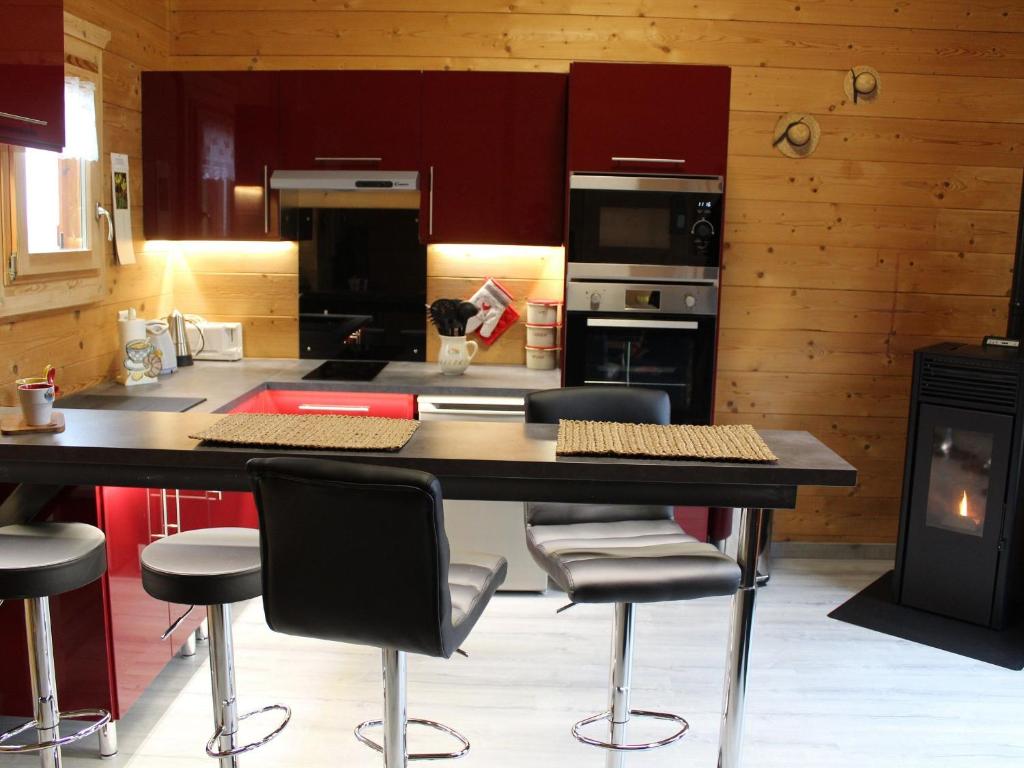 a kitchen with a table and chairs in a room at Gîte Barbas, 2 pièces, 2 personnes - FR-1-584-16 