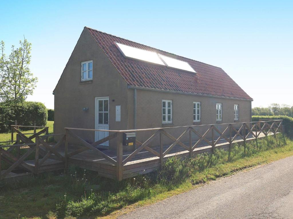 a house with a wooden fence next to a road at Holiday home Nykøbing M VII 