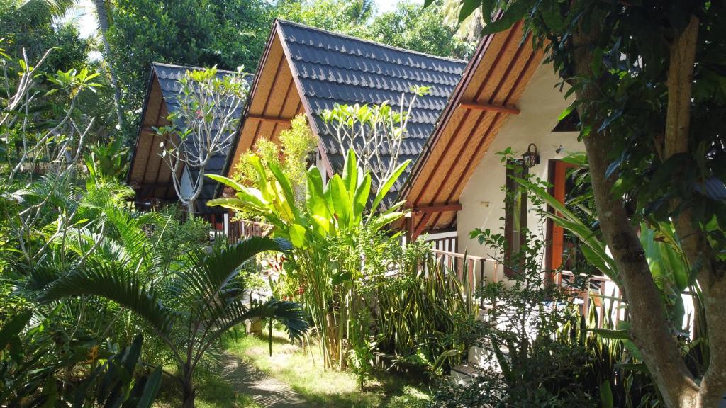a house in the middle of a garden at Jingga Bungalow Penida in Nusa Penida