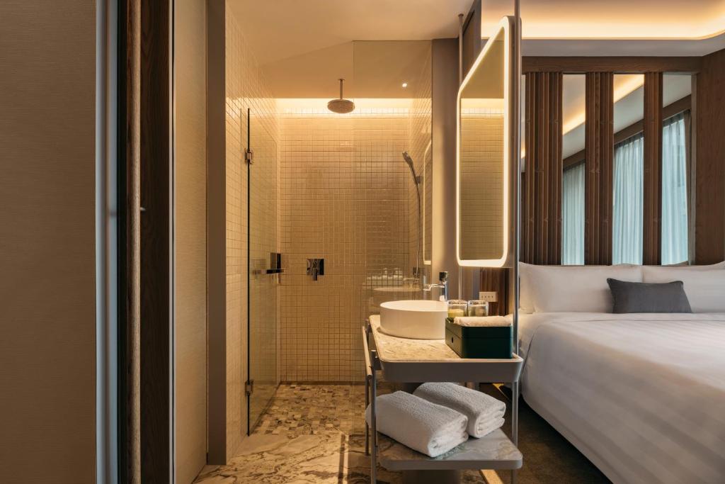 Giường trong phòng chung tại Pan Pacific Orchard
