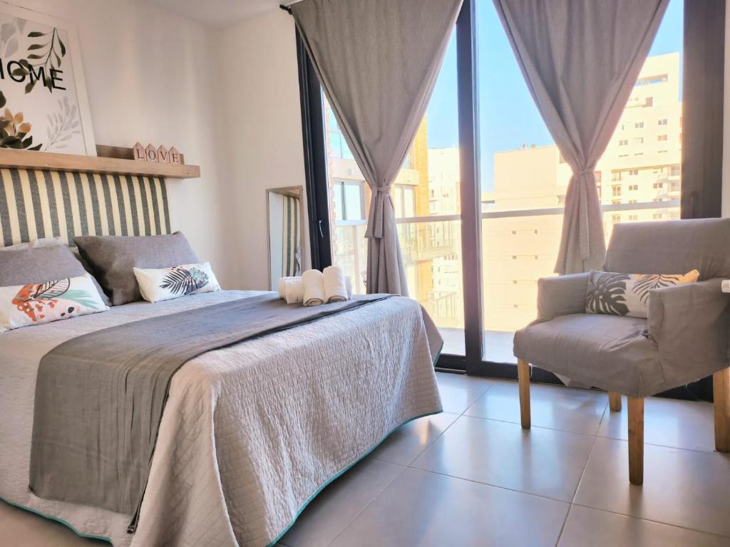 A bed or beds in a room at Dptos amoblados NQN - Excelente ubicacion- ZONA CENTRO