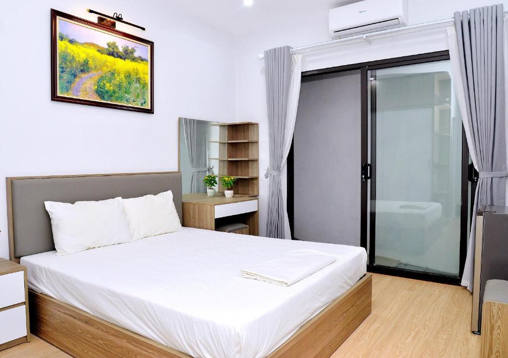 Giường trong phòng chung tại Blue Home Serviced Apartment Hanoi