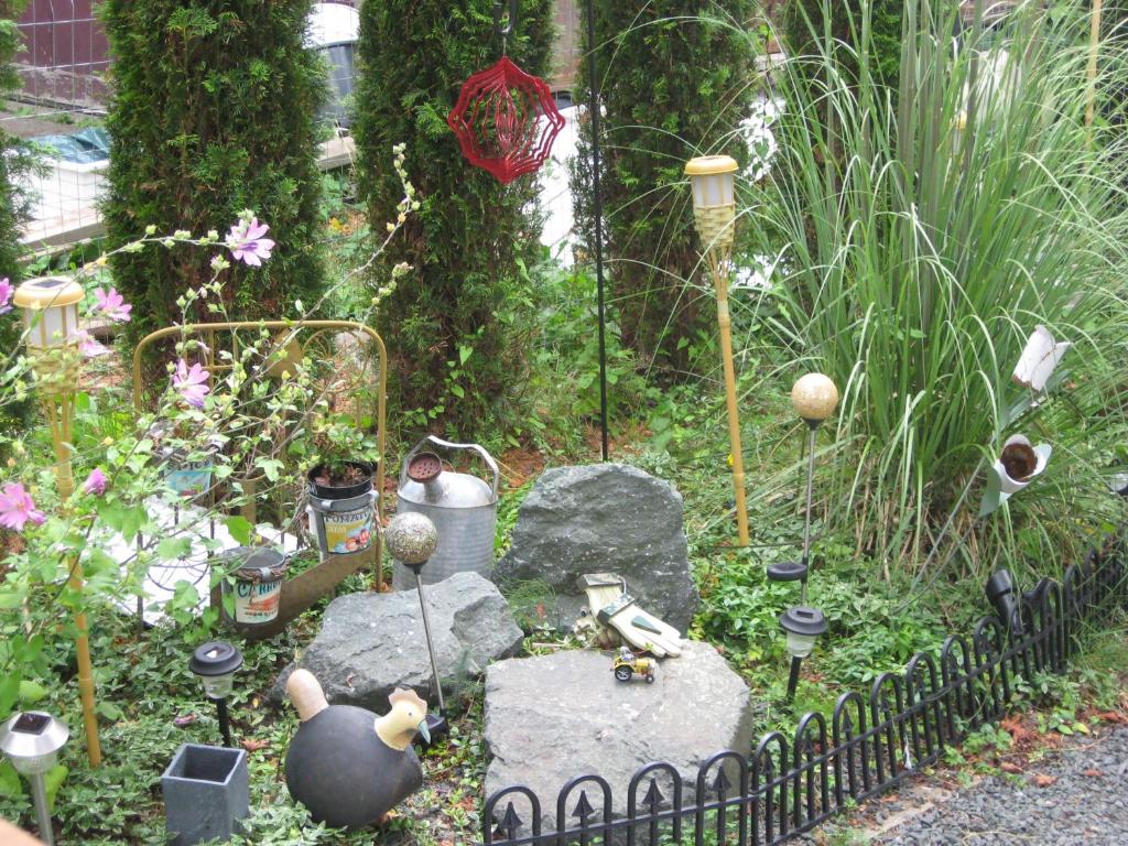 a garden with some rocks and some plants at Money Pennies Bed and Breakfast in Campbell River