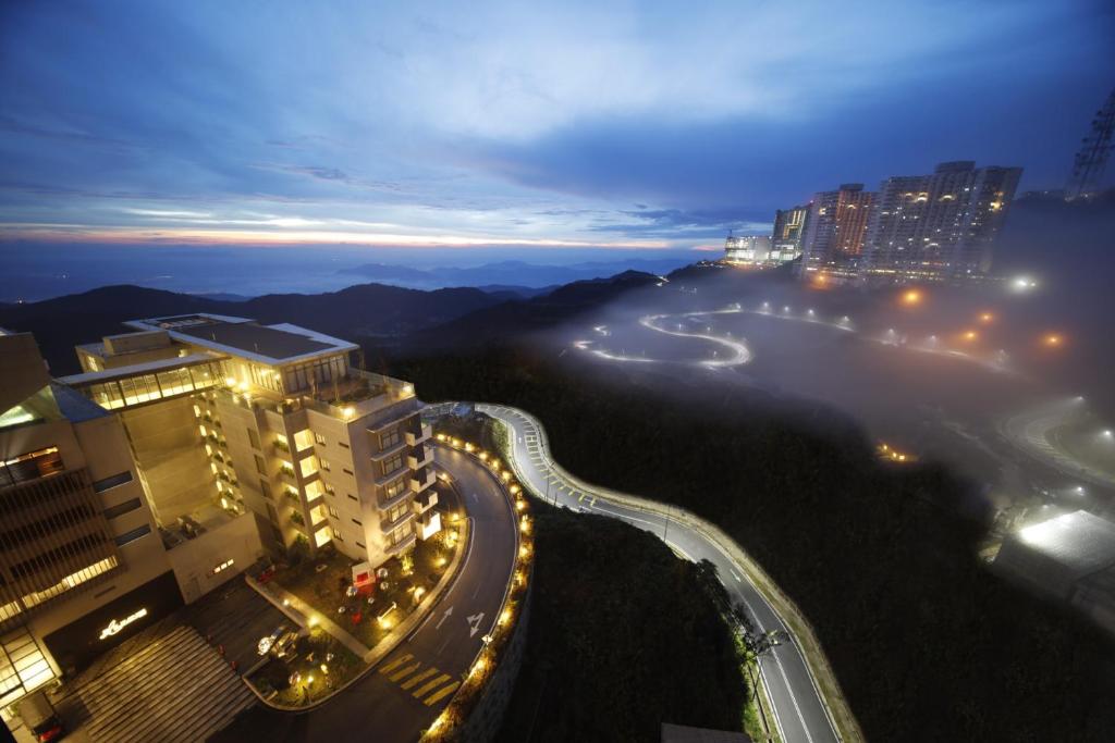a view of a city at night with a highway at Yume Dream Genting Highlands in Genting Highlands