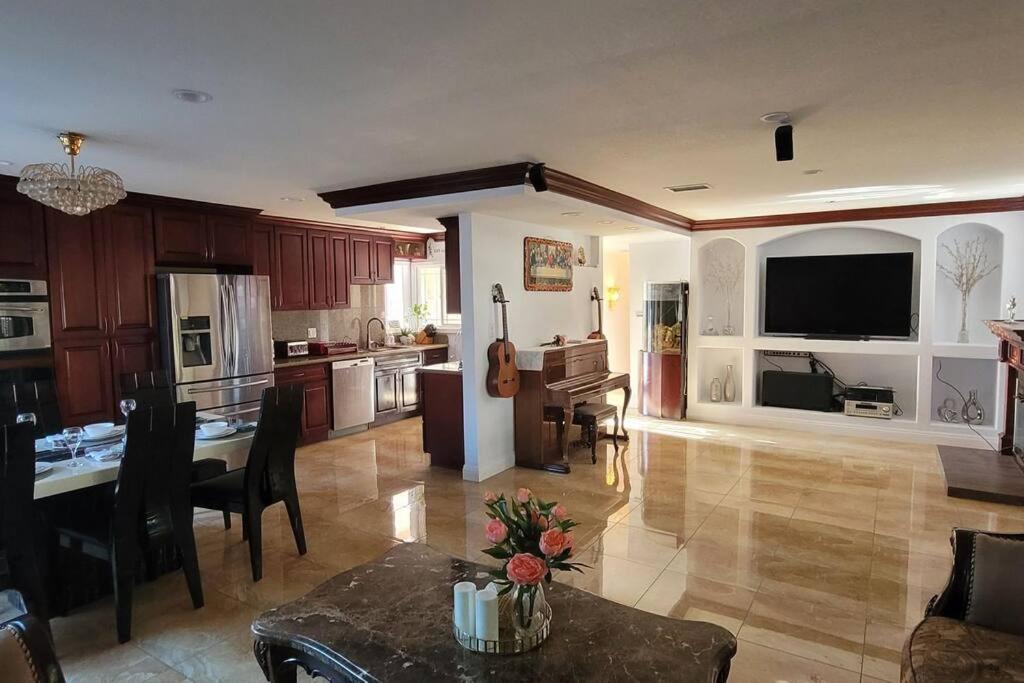 a living room with a kitchen and a dining room at Luxstay in Huntington Beach in Huntington Beach